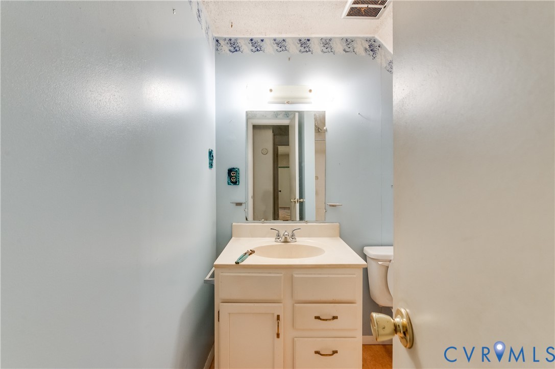 1006 Pineville Road North Chesterfield, VA 23236 - Photo 19 of 22 a bathroom with a sink and a mirror