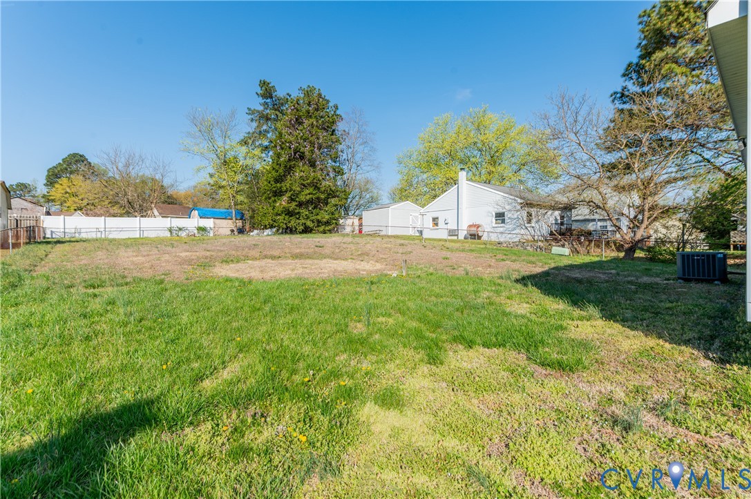 1006 Pineville Road North Chesterfield, VA 23236 - Photo 22 of 22 a front view of a house with a yard and garage