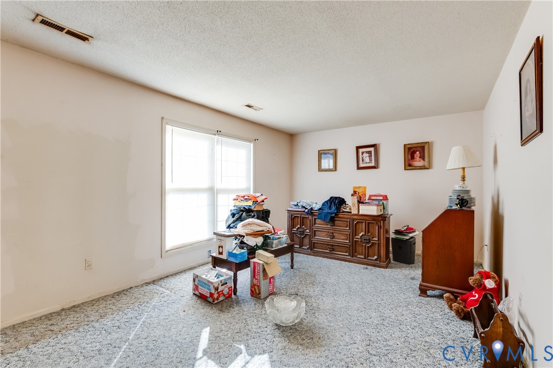 1006 Pineville Road North Chesterfield, VA 23236 - Photo 5 of 22 a view of a room with workspace and a window