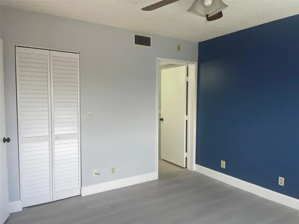 an empty room with closet area