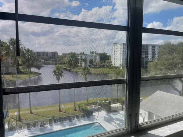 a view of a glass door and a window