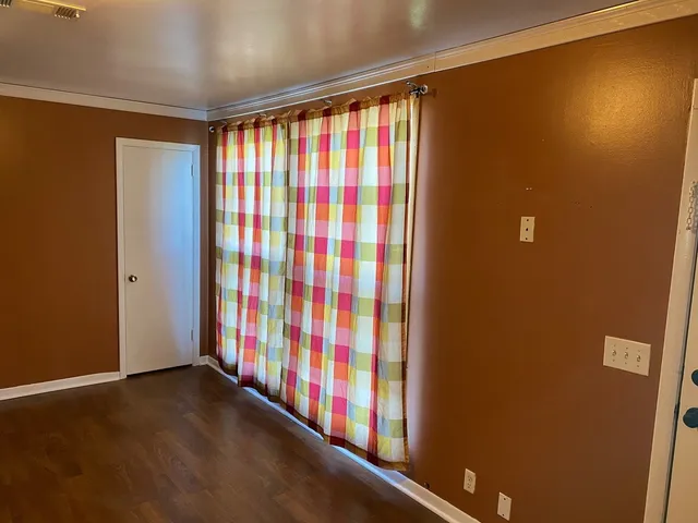 a view of a room with windows