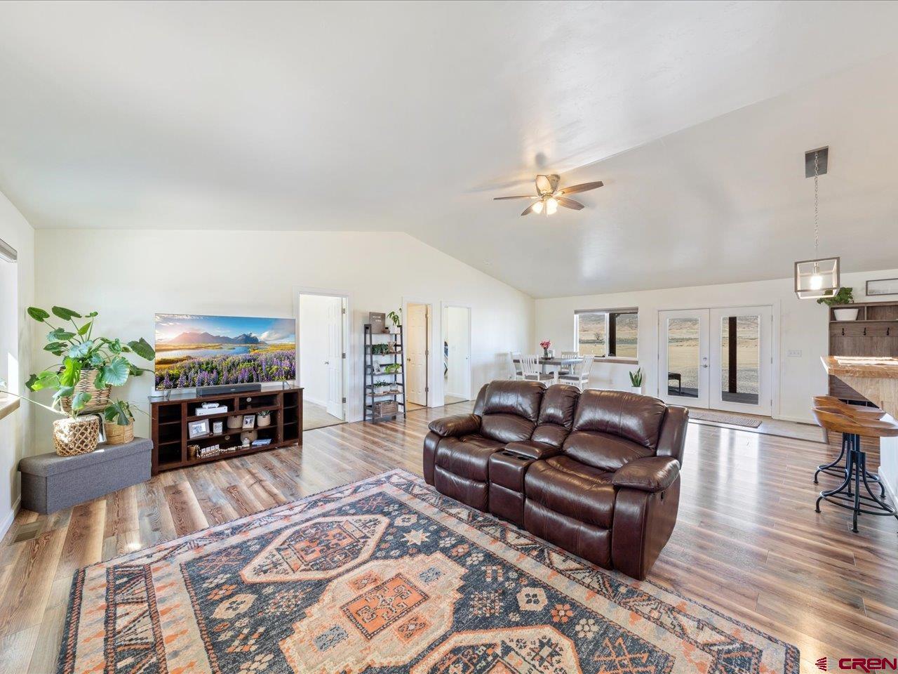 3580 Ruth Lane Delta, CO 81416 - Photo 11 of 35 a living room with furniture fireplace and a potted plant