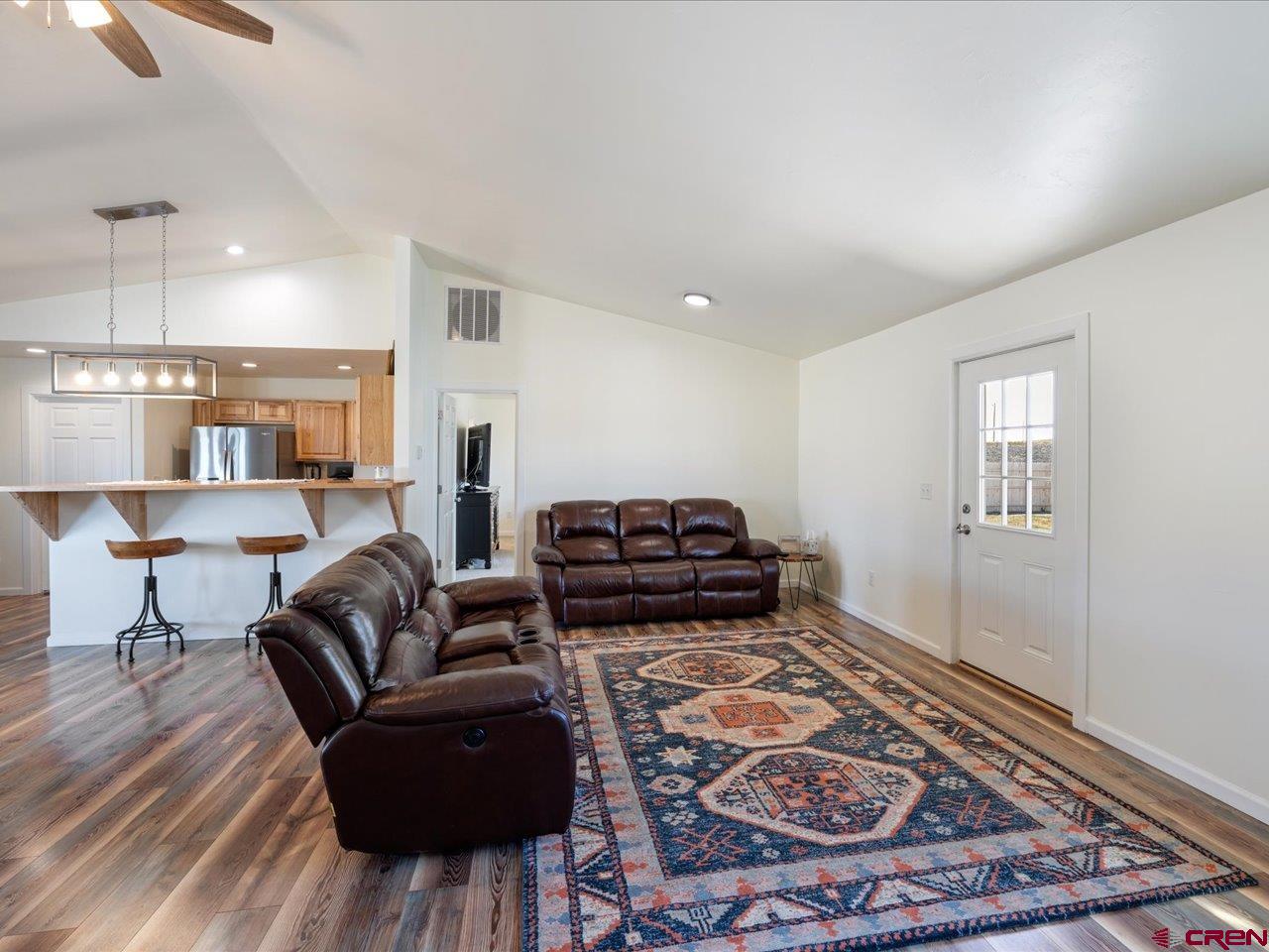 3580 Ruth Lane Delta, CO 81416 - Photo 13 of 35 a living room with furniture and a rug