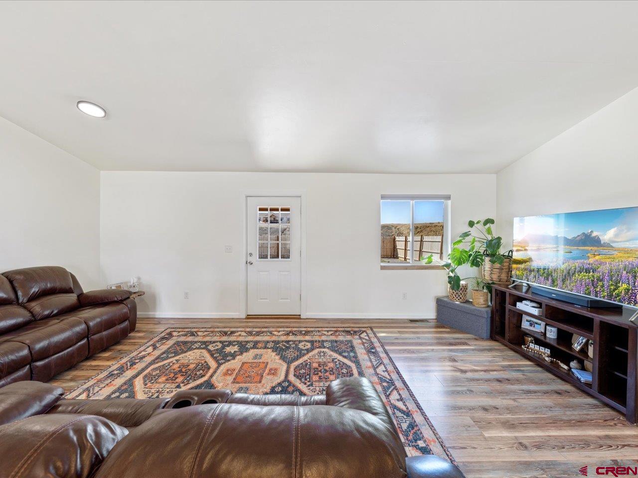 3580 Ruth Lane Delta, CO 81416 - Photo 14 of 35 a bedroom with a bed and a couch