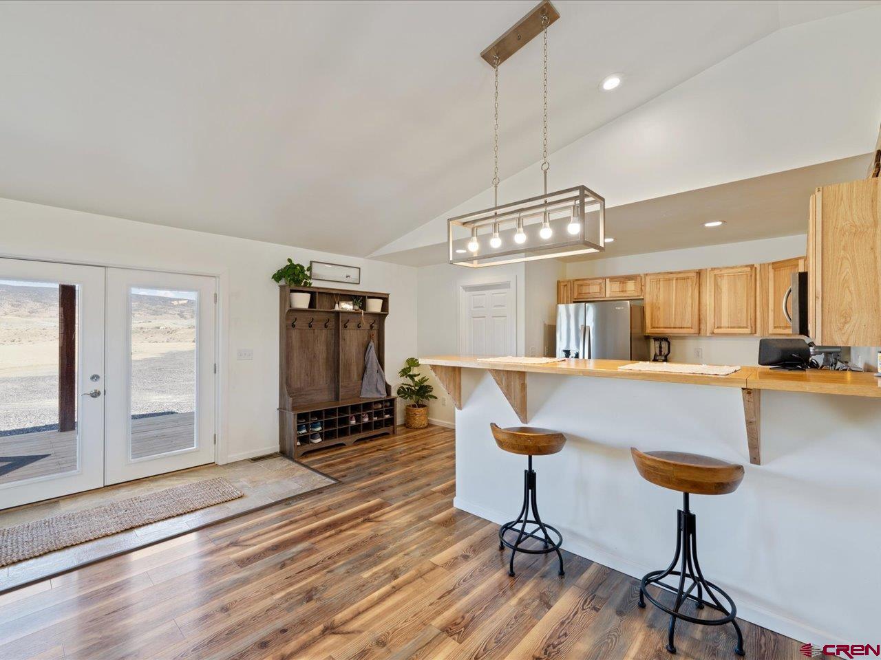 3580 Ruth Lane Delta, CO 81416 - Photo 15 of 35 a living room with furniture and a chandelier
