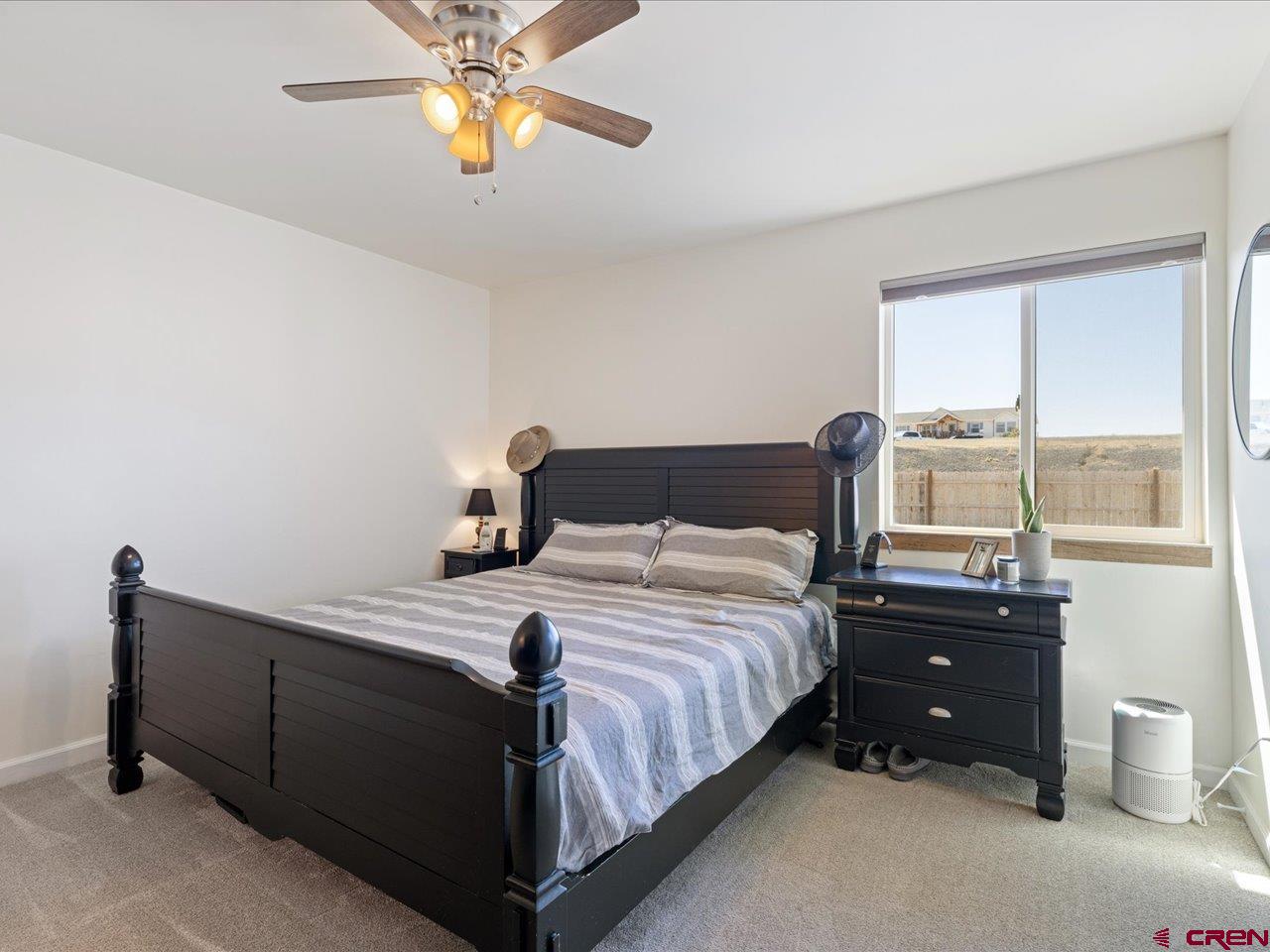 3580 Ruth Lane Delta, CO 81416 - Photo 17 of 35 a bedroom with a bed and a window