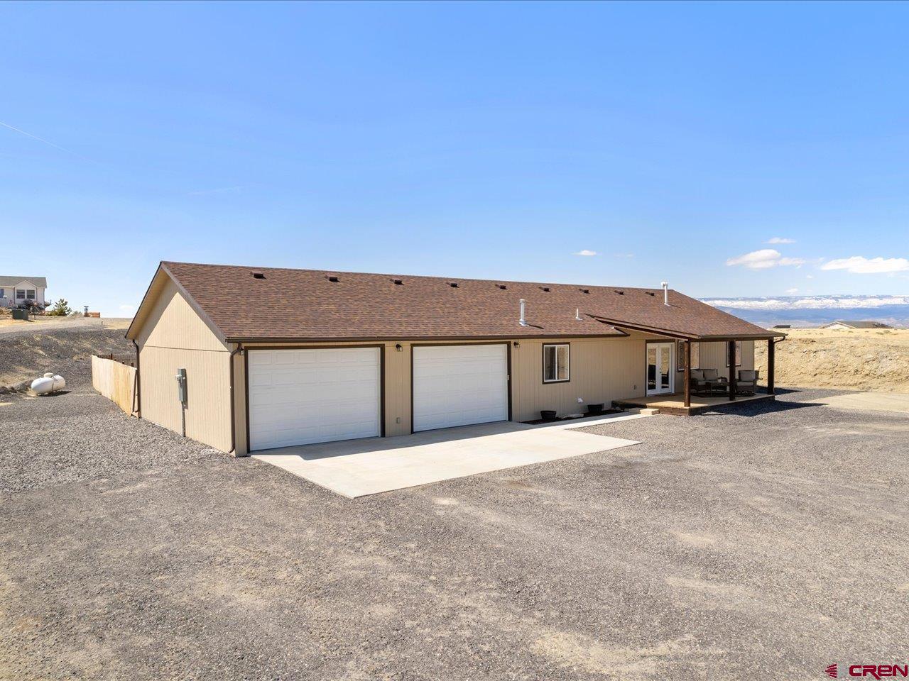 3580 Ruth Lane Delta, CO 81416 - Photo 2 of 35 a view of a house with a big yard and large tree