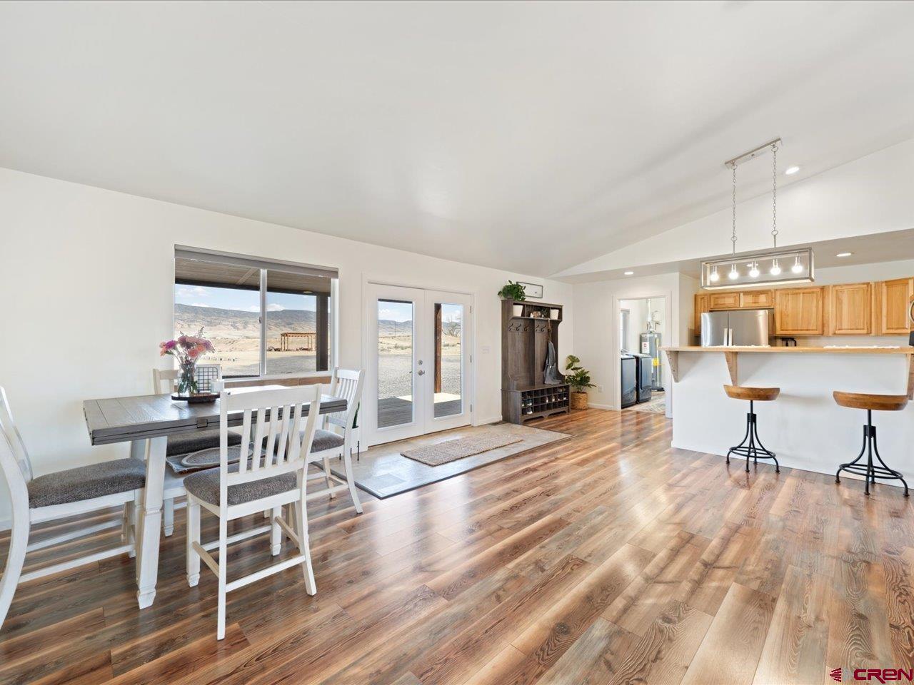 3580 Ruth Lane Delta, CO 81416 - Photo 7 of 35 a view of a dining room with furniture and wooden floor