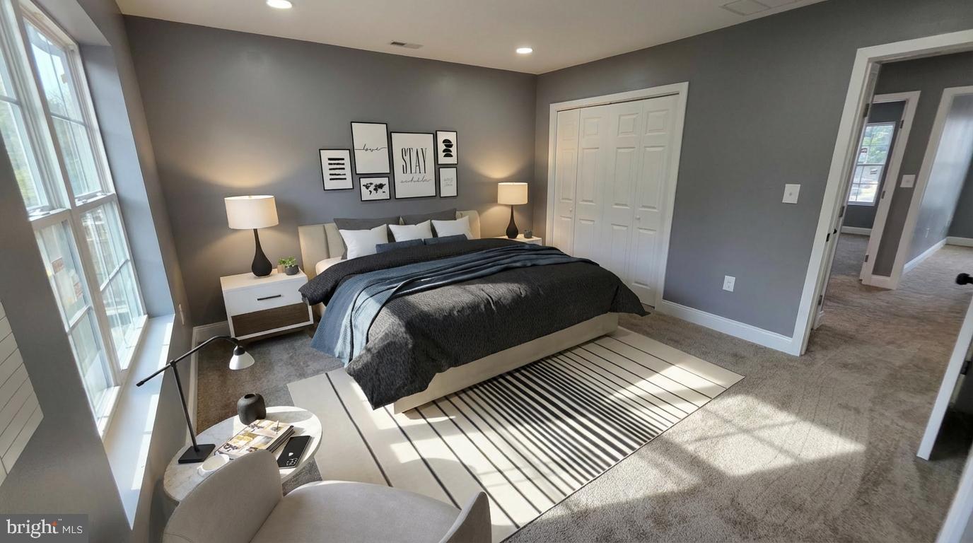 7544 Maury Road Windsor Mill, MD 21244 - Photo 11 of 14 a bedroom with a bed and glass walk in closet