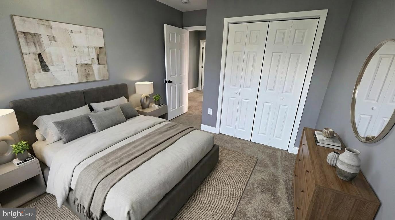 7544 Maury Road Windsor Mill, MD 21244 - Photo 14 of 14 a bed room with a bed and a mirror