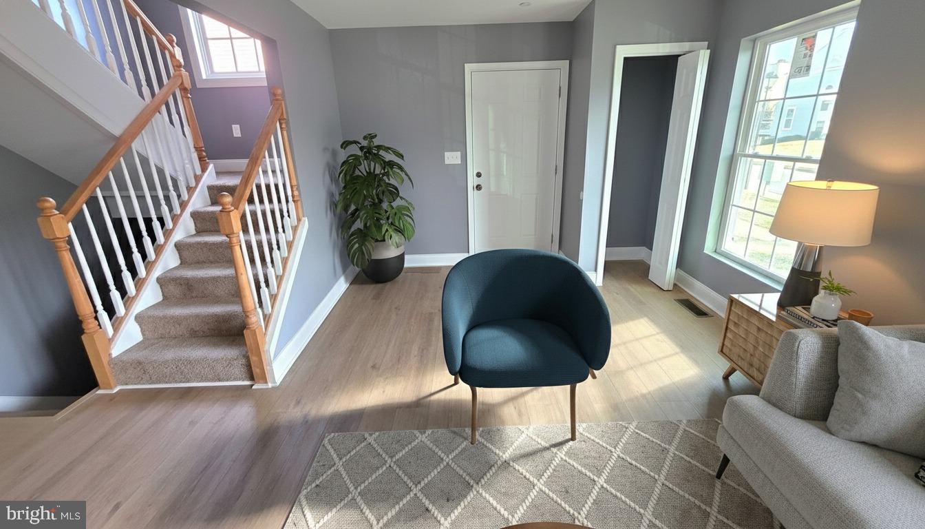 7544 Maury Road Windsor Mill, MD 21244 - Photo 2 of 14 a living room with furniture and a lamp