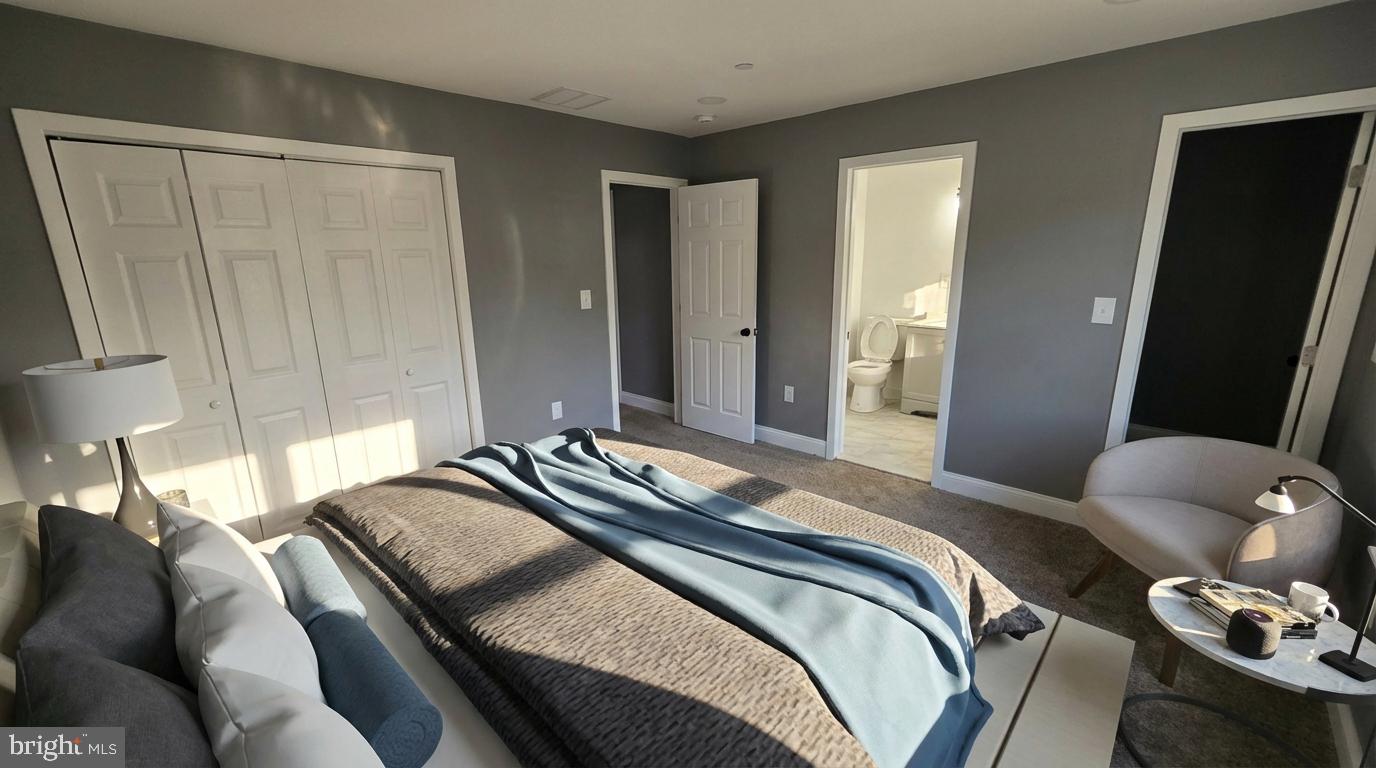7544 Maury Road Windsor Mill, MD 21244 - Photo 10 of 14 a bedroom with a bed and wooden floor