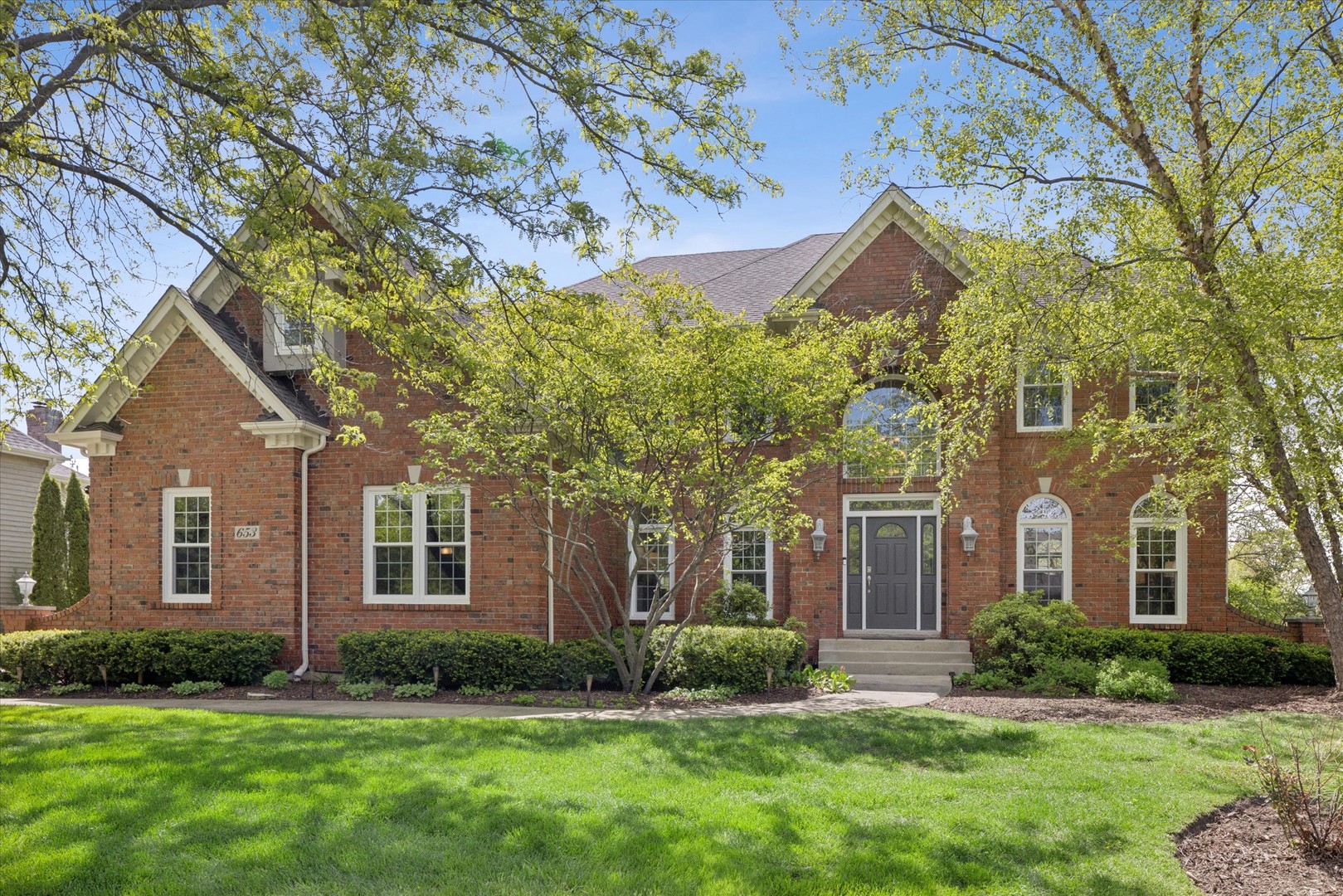 653 Limestone Drive Batavia, IL 60510 - Photo 1 of 46 front view of a house with a yard