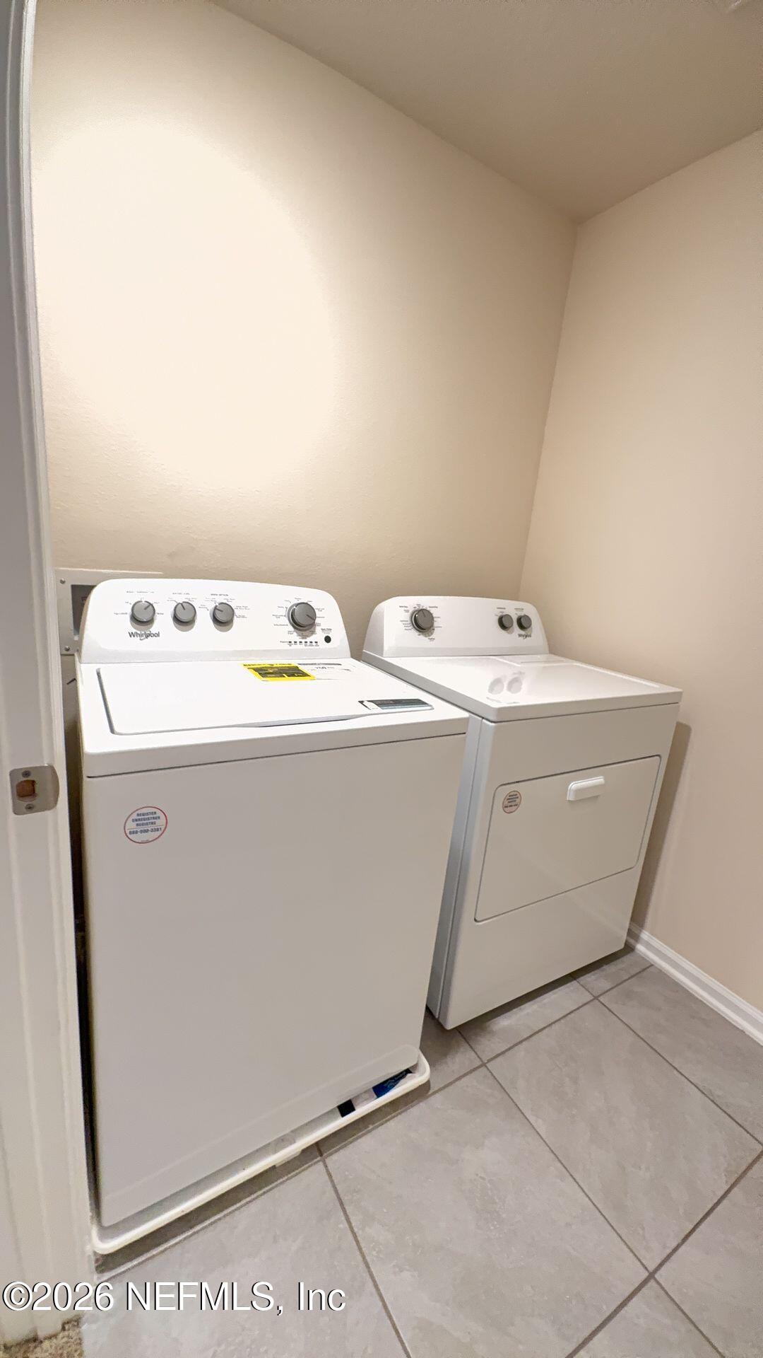 144 Redbud Road Palm Coast, FL 32137 - Photo 11 of 29 a utility room with dryer and washer