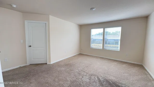 an empty room with windows