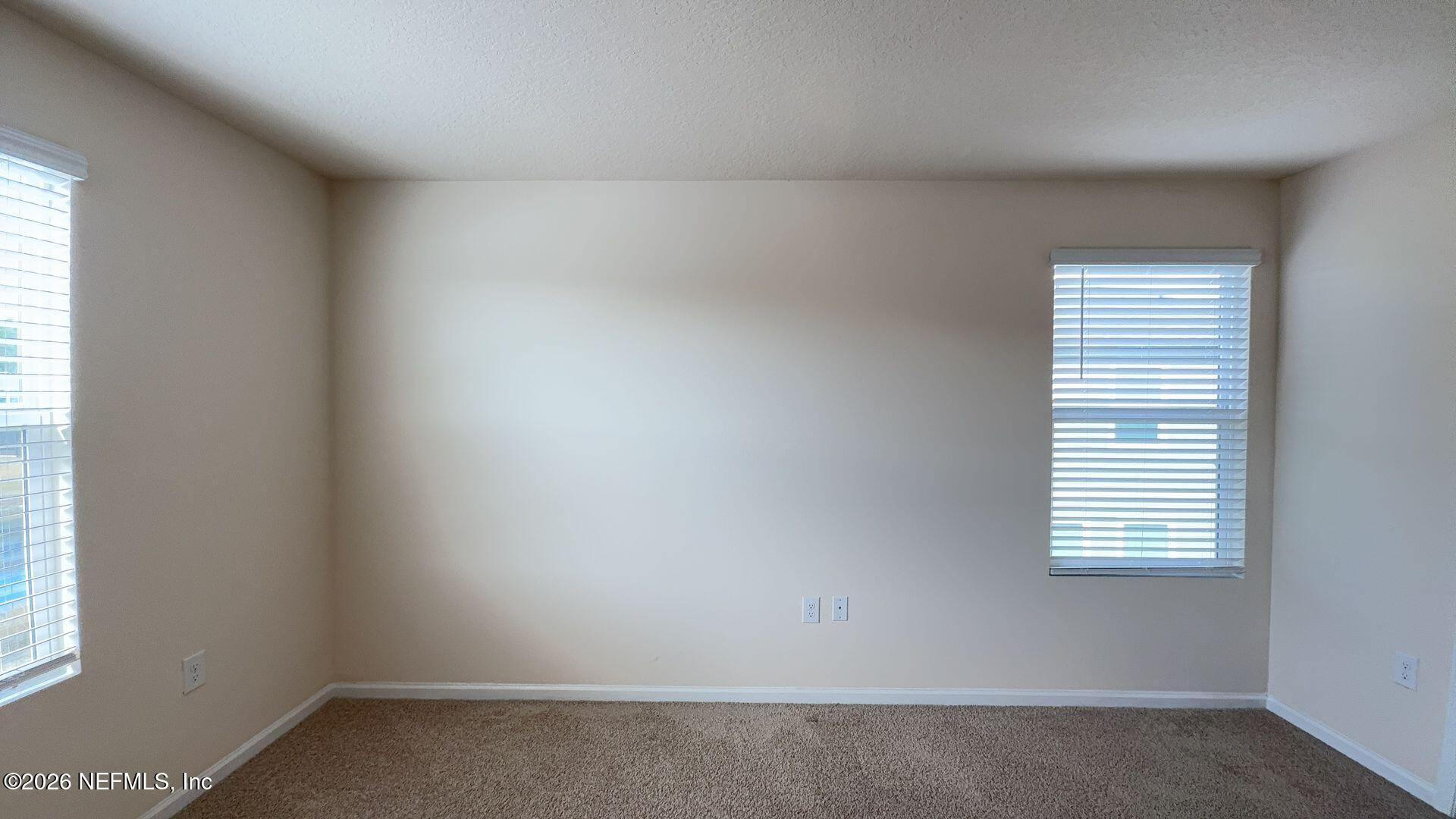 144 Redbud Road Palm Coast, FL 32137 - Photo 15 of 29 an empty room with a window