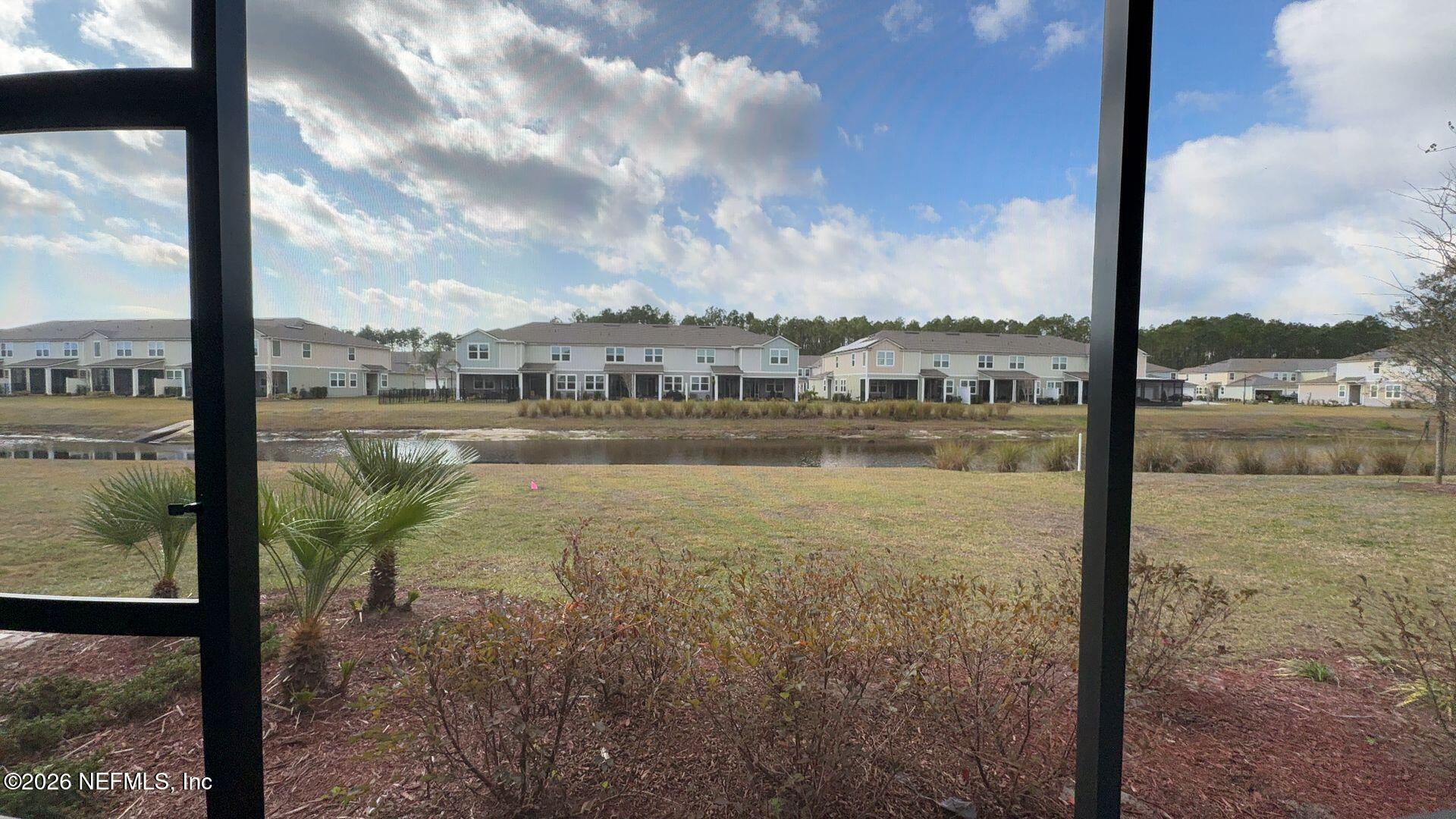 144 Redbud Road Palm Coast, FL 32137 - Photo 27 of 29 a view of a lake