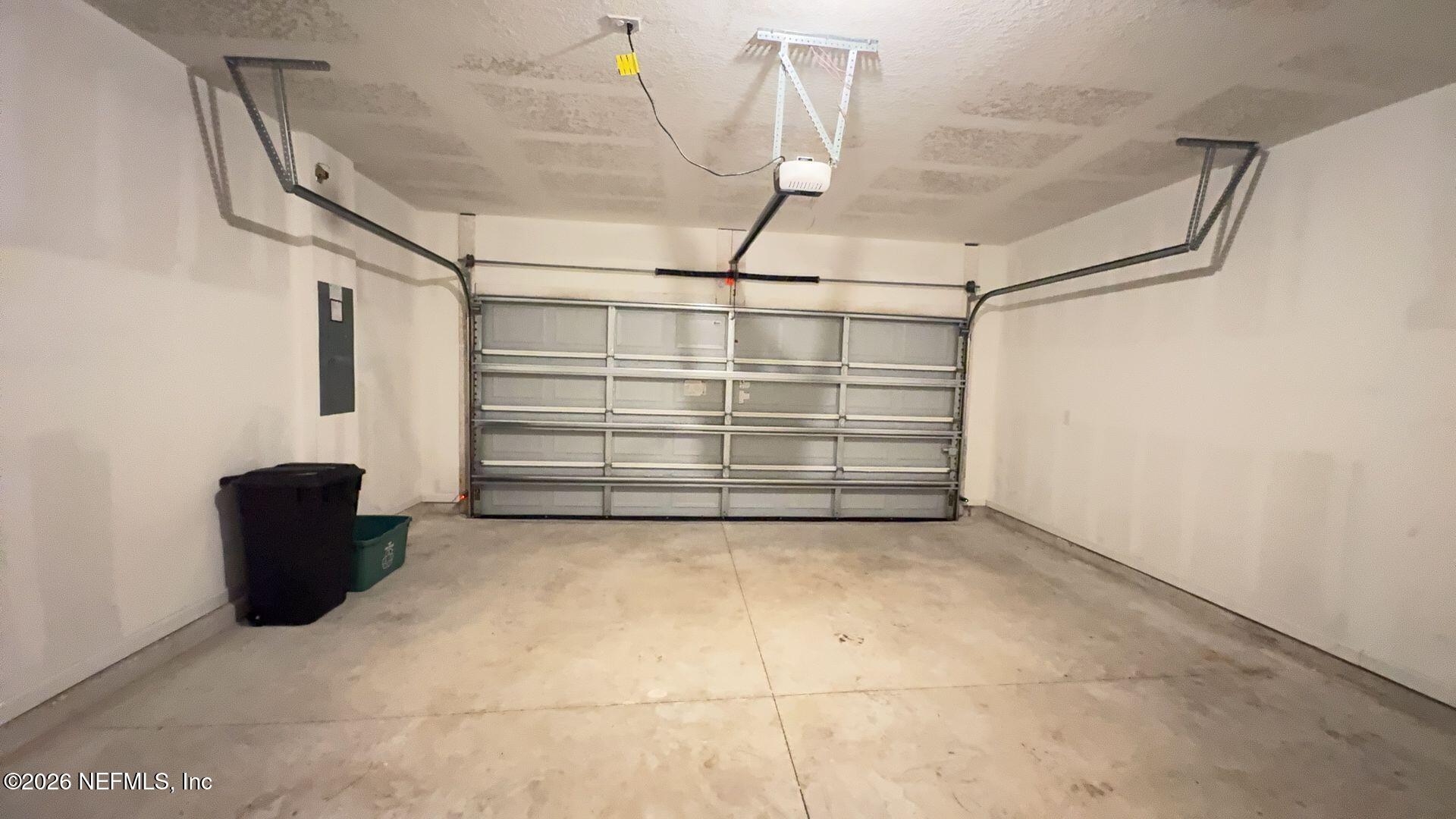 144 Redbud Road Palm Coast, FL 32137 - Photo 29 of 29 a view of a garage with storage