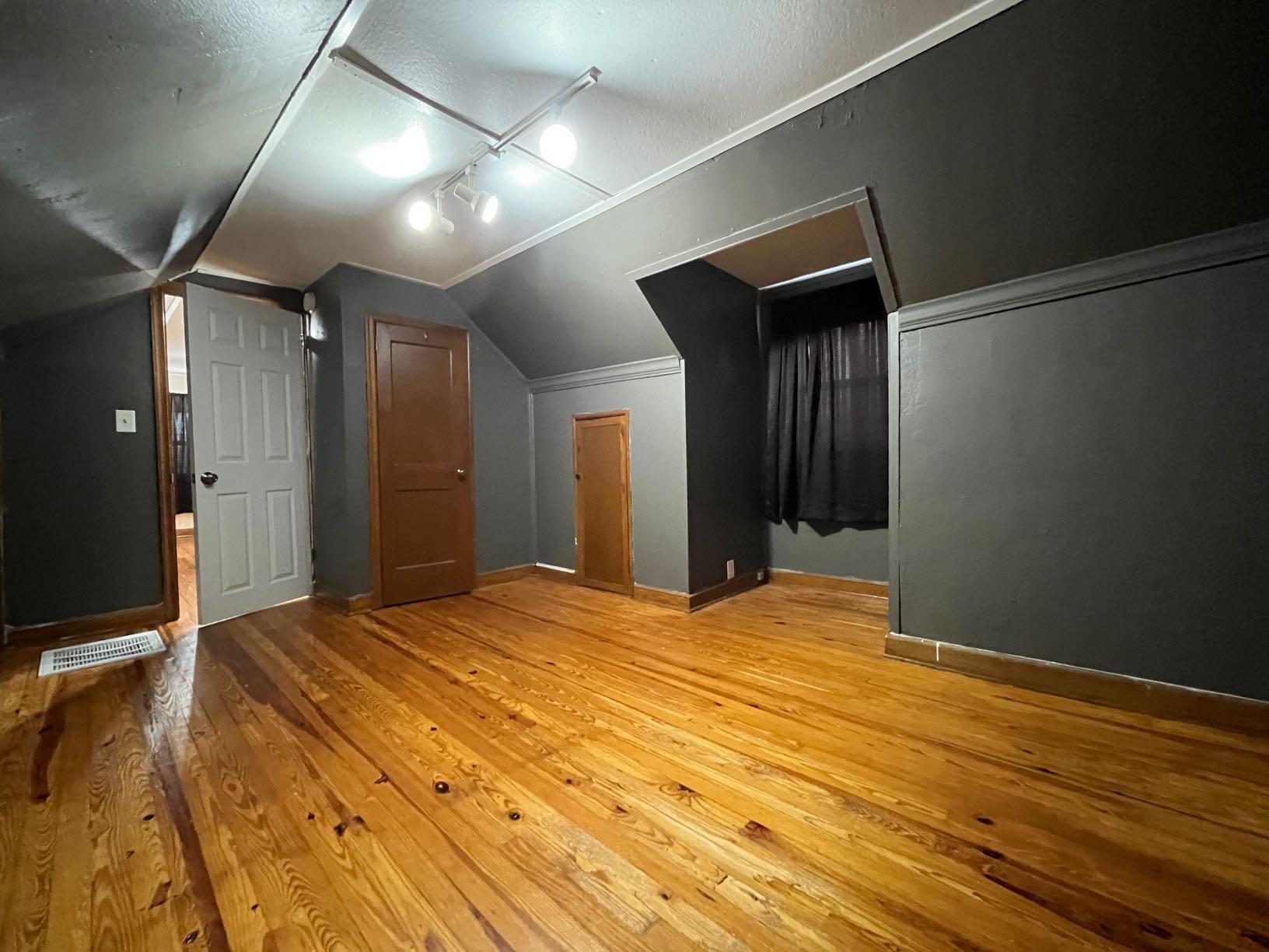 2610 Colonial Avenue Southwest Roanoke, VA 24015 - Photo 3 of 15 a view of an empty room with wooden floor