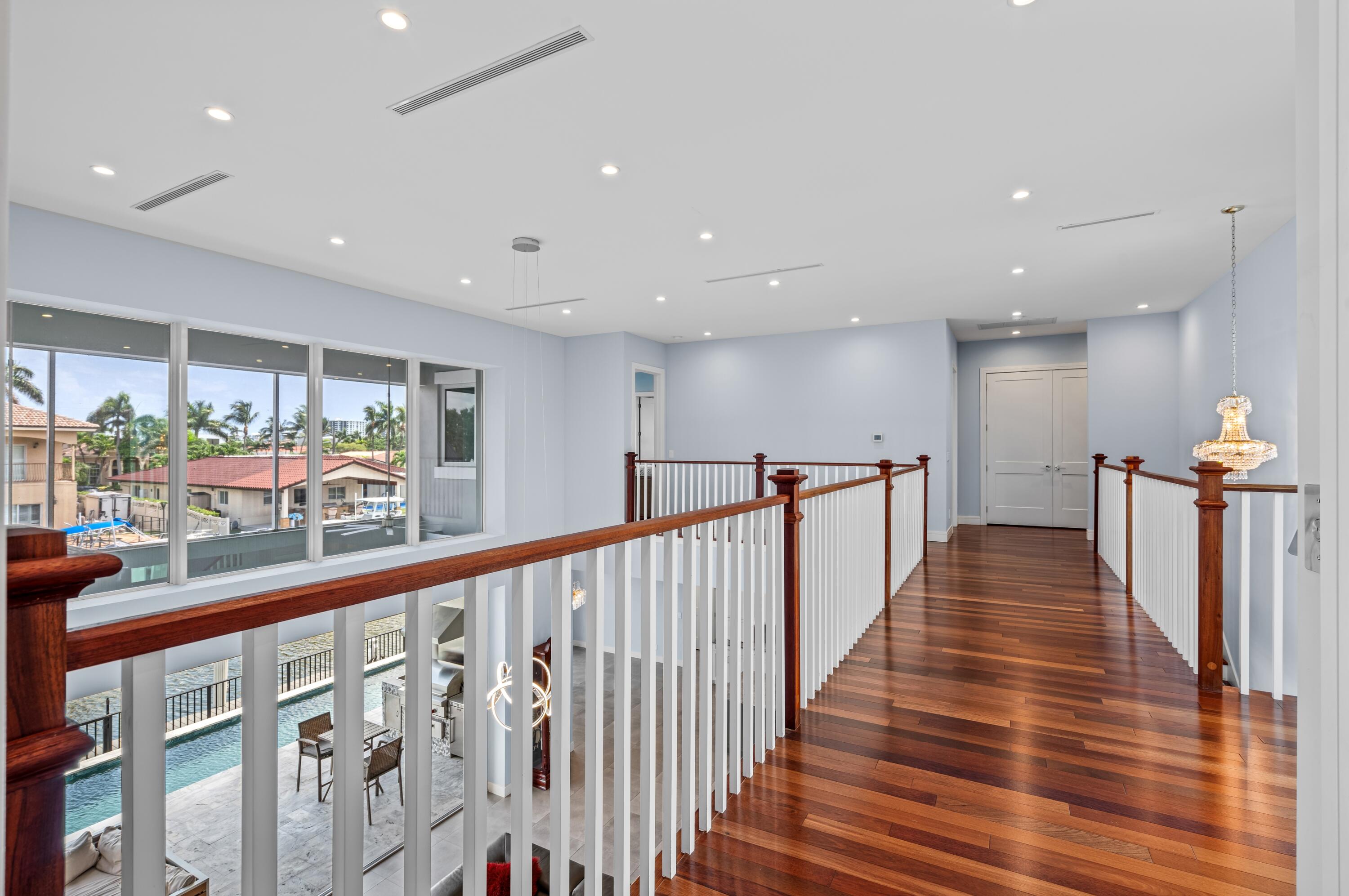 807 Dover Street Boca Raton, FL 33487 - Photo 15 of 43 a view of a kitchen with wooden floor and stairs