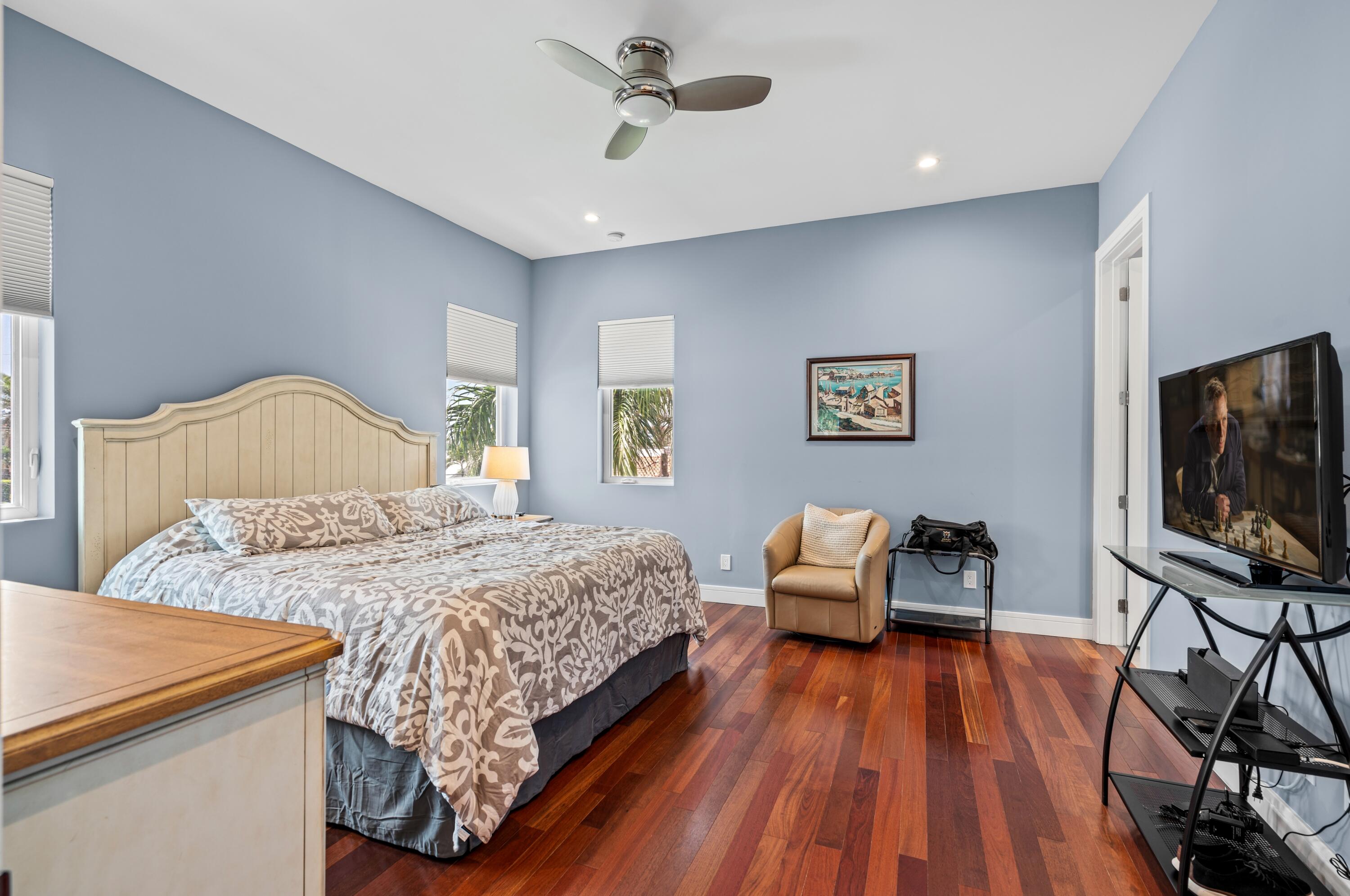 807 Dover Street Boca Raton, FL 33487 - Photo 20 of 43 a bedroom with a bed and a flat screen tv