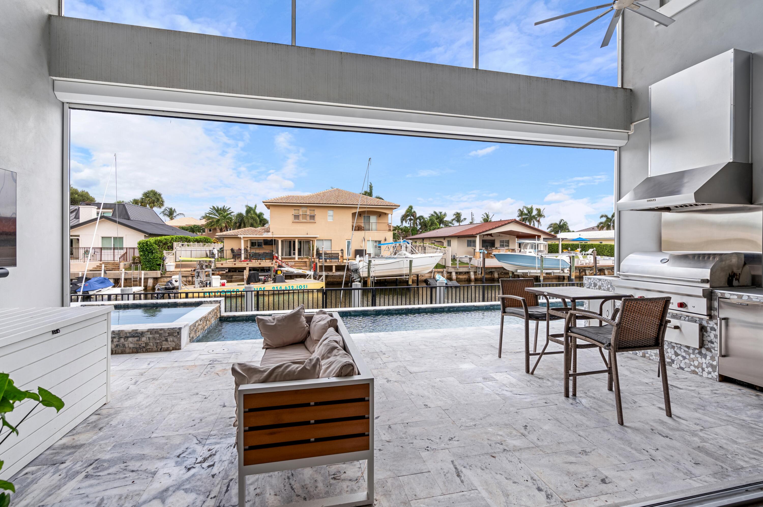 807 Dover Street Boca Raton, FL 33487 - Photo 25 of 43 a living room with furniture a rug and white walls