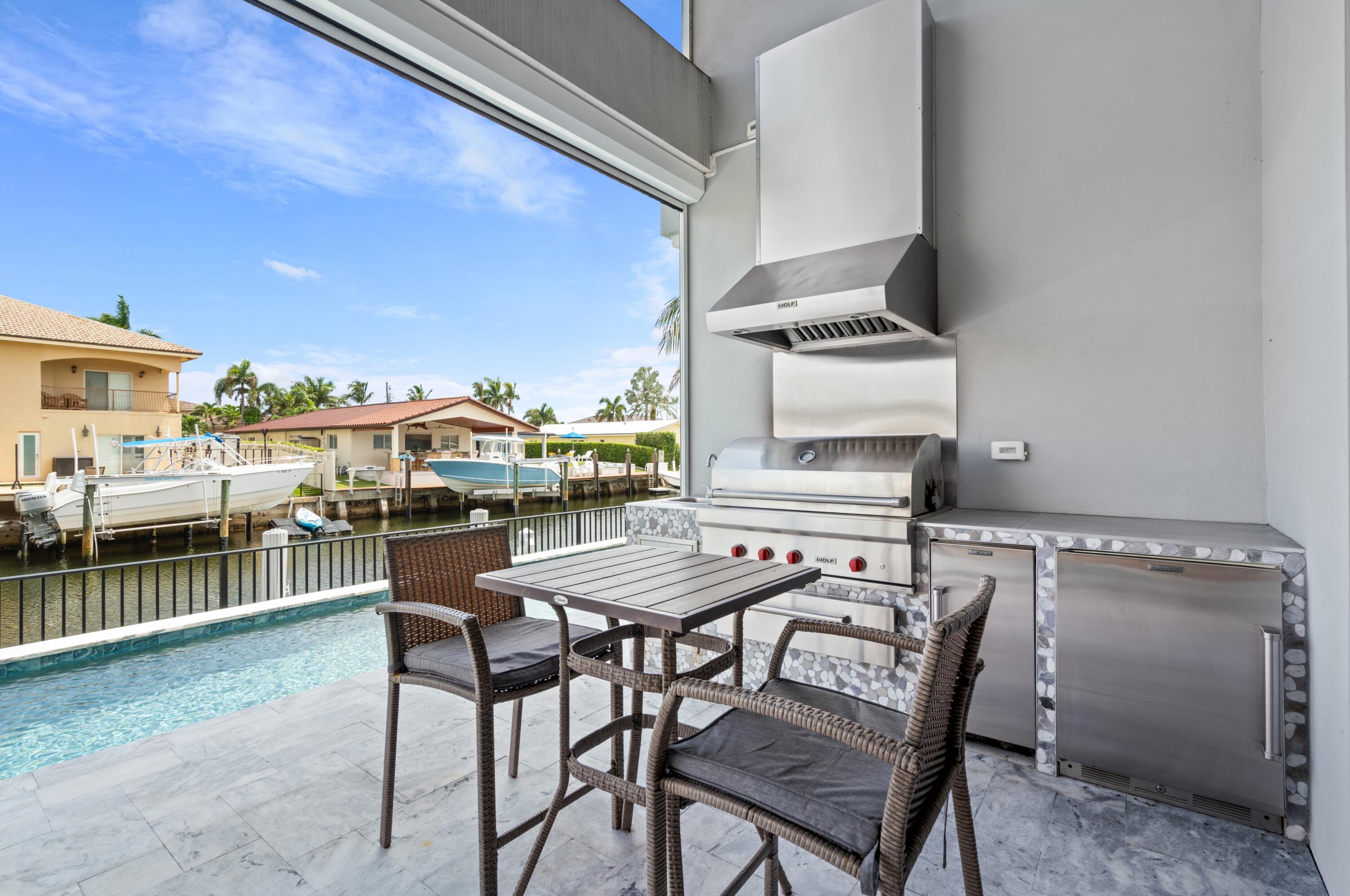 807 Dover Street Boca Raton, FL 33487 - Photo 27 of 43 a view of a dining room with furniture and wooden floor