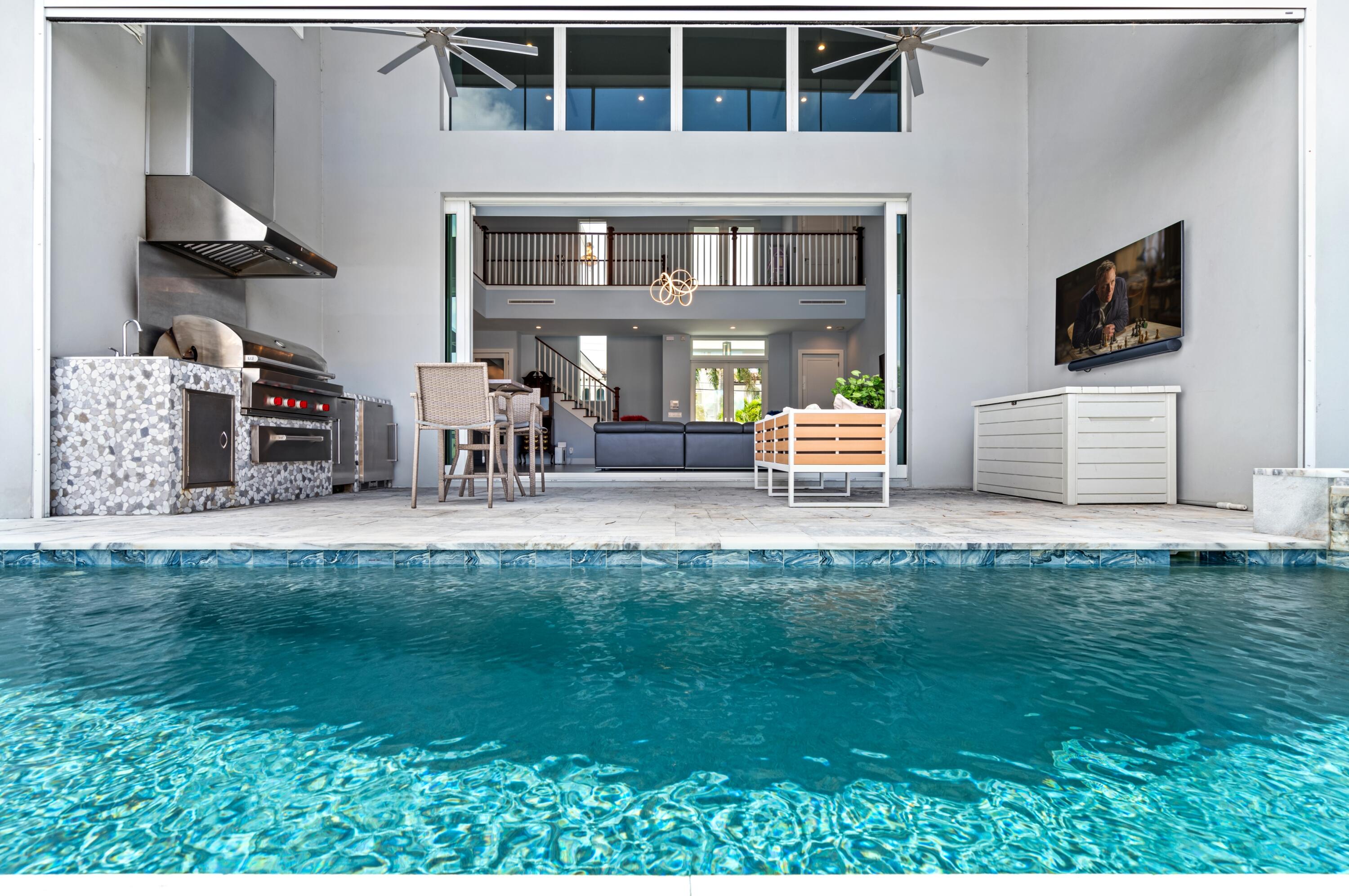 807 Dover Street Boca Raton, FL 33487 - Photo 29 of 43 a view of a house with backyard porch and sitting area