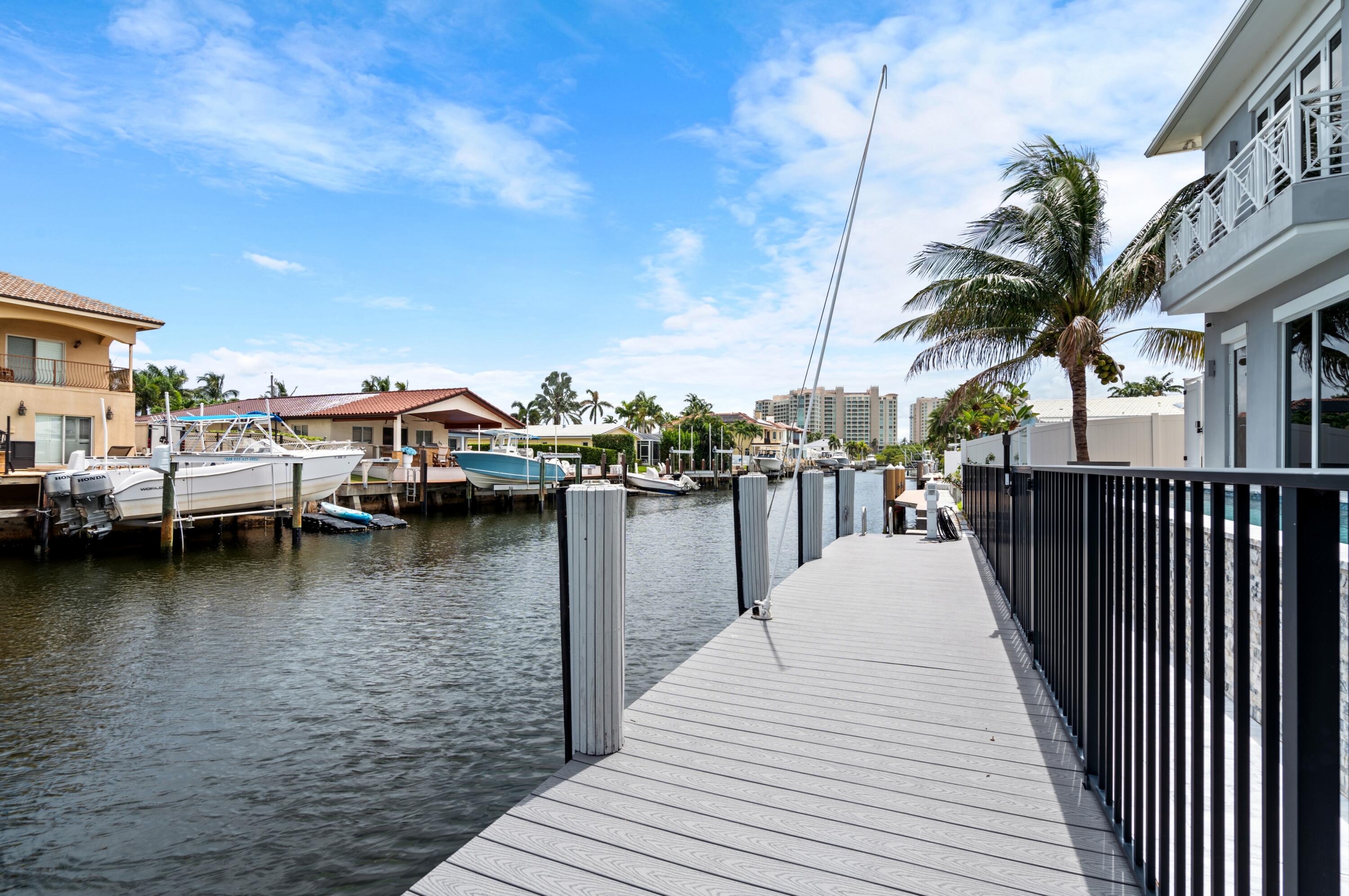 807 Dover Street Boca Raton, FL 33487 - Photo 37 of 43 a view of a lake with boats and palm trees