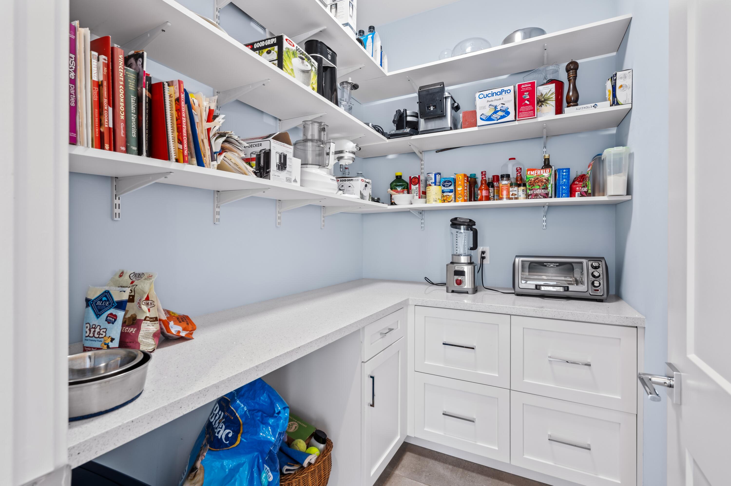 807 Dover Street Boca Raton, FL 33487 - Photo 10 of 43 a storage room with lots of clutter and cabinets