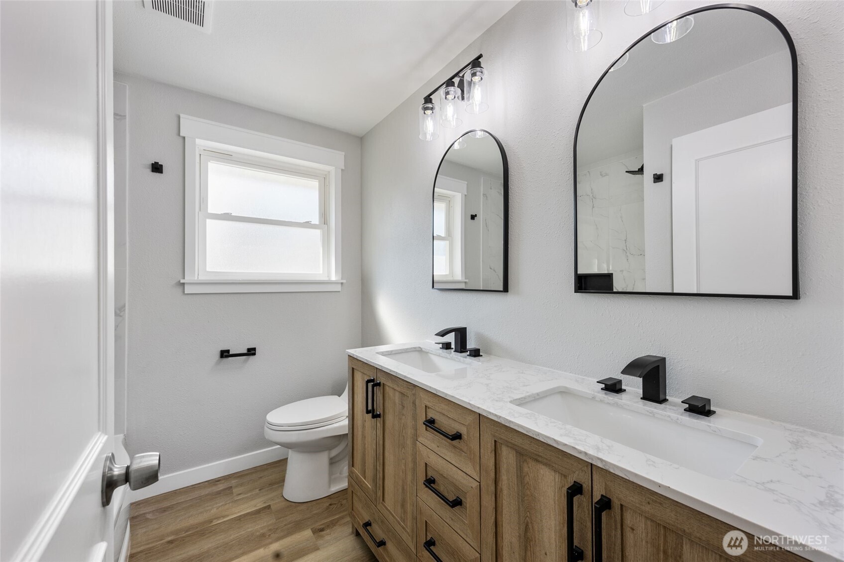 247 Northeast Ivy Ephrata, WA 98823 - Photo 17 of 40 a bathroom with a double vanity sink mirror and toilet