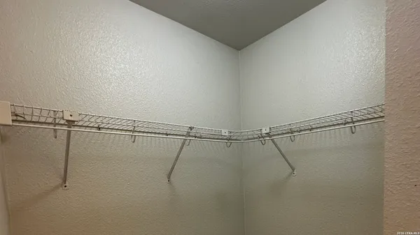 a kitchen with a refrigerator and a stove top oven