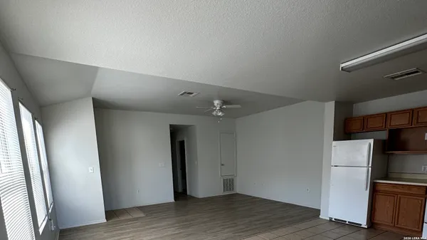 a view of kitchen with furniture and window