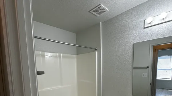 a view of a living room with a mirror