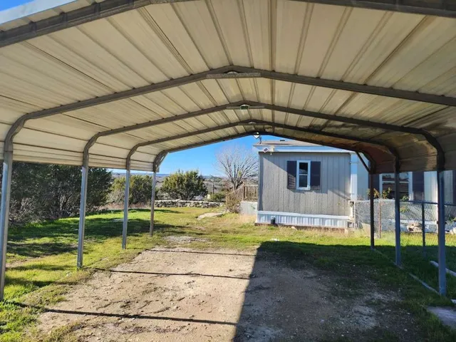 a view of a house with backyard