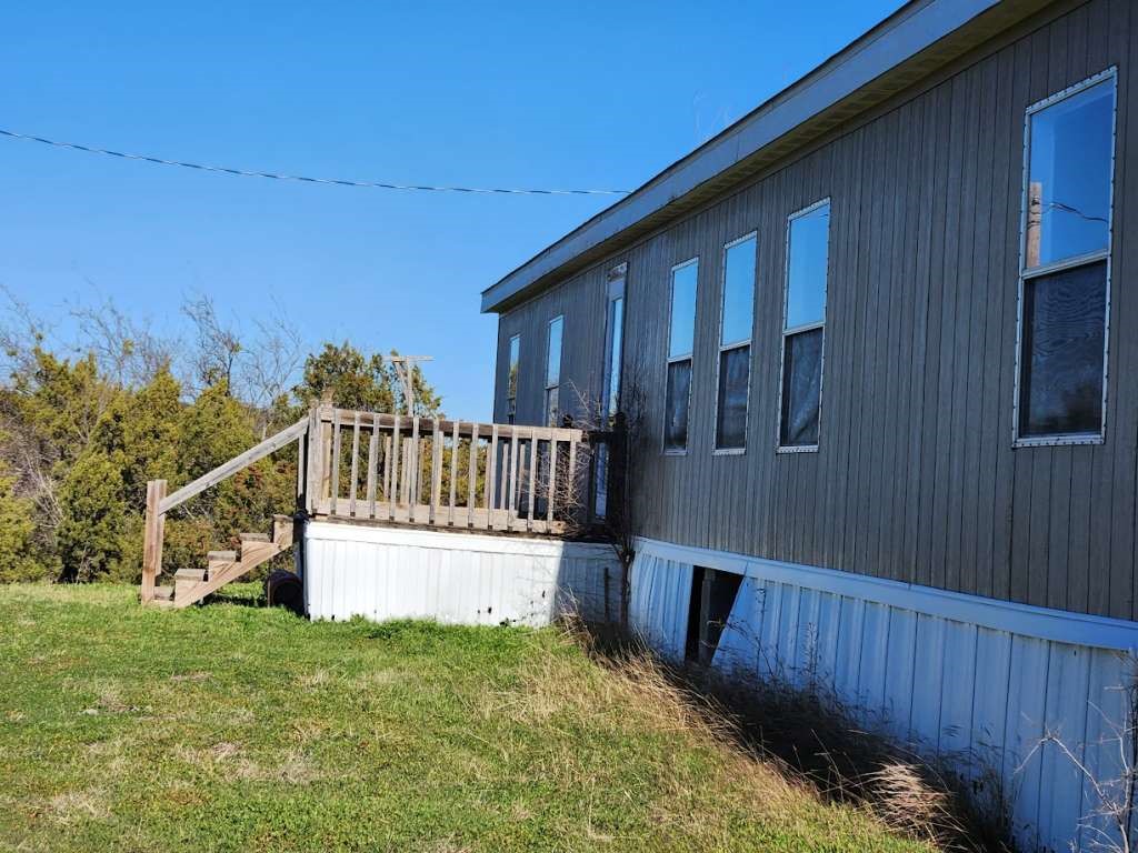 7640 Wd Court Lipan, TX 76462 - Photo 5 of 12 a view of a house with wooden fence