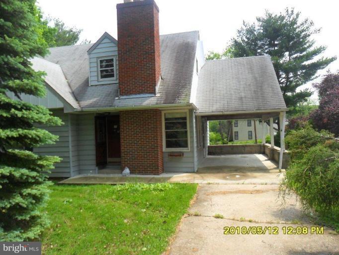 4005 High Point Road Ellicott City, MD 21042 - Photo 1 of 2 a front view of a house with garden