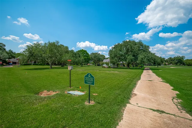 a view of a golf course with a garden