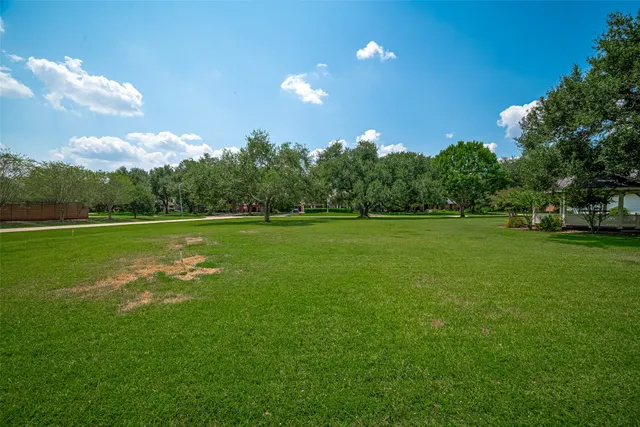 a view of a golf course with a lake