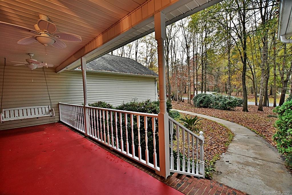 13022 Hamilton Pl Drive Fort Mill, SC 29708 - Photo 4 of 31 a view of a porch with wooden floor and roof