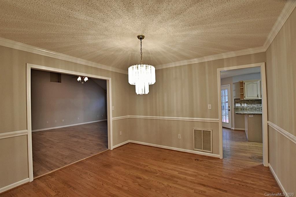 13022 Hamilton Pl Drive Fort Mill, SC 29708 - Photo 7 of 31 an empty room with wooden floor and ceiling fan