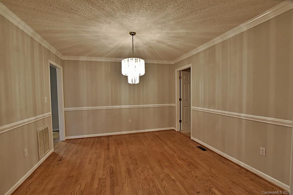 13022 Hamilton Pl Drive Fort Mill, SC 29708 - Photo 8 of 31 a view of an empty room with wooden floor and a window