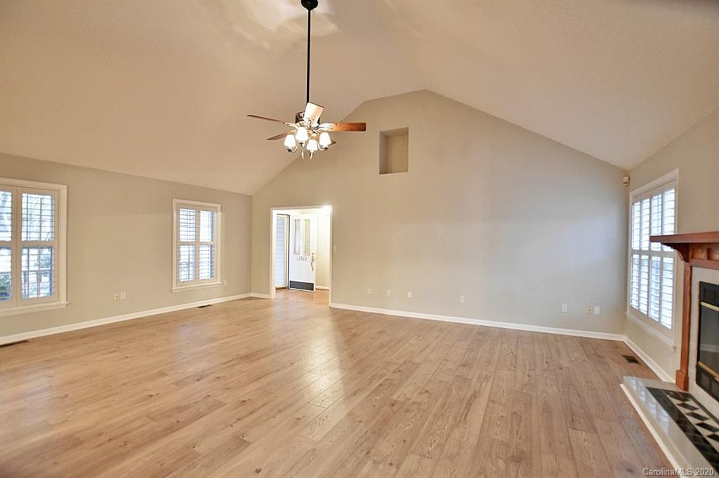 13022 Hamilton Pl Drive Fort Mill, SC 29708 - Photo 10 of 31 a view of an empty room with a window and wooden floor