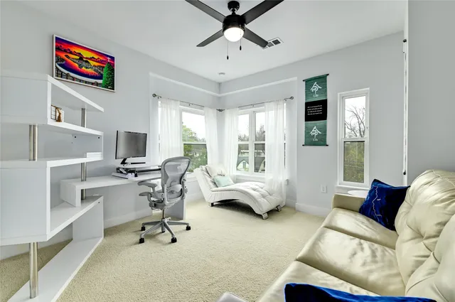 a dining room with furniture and wooden floor