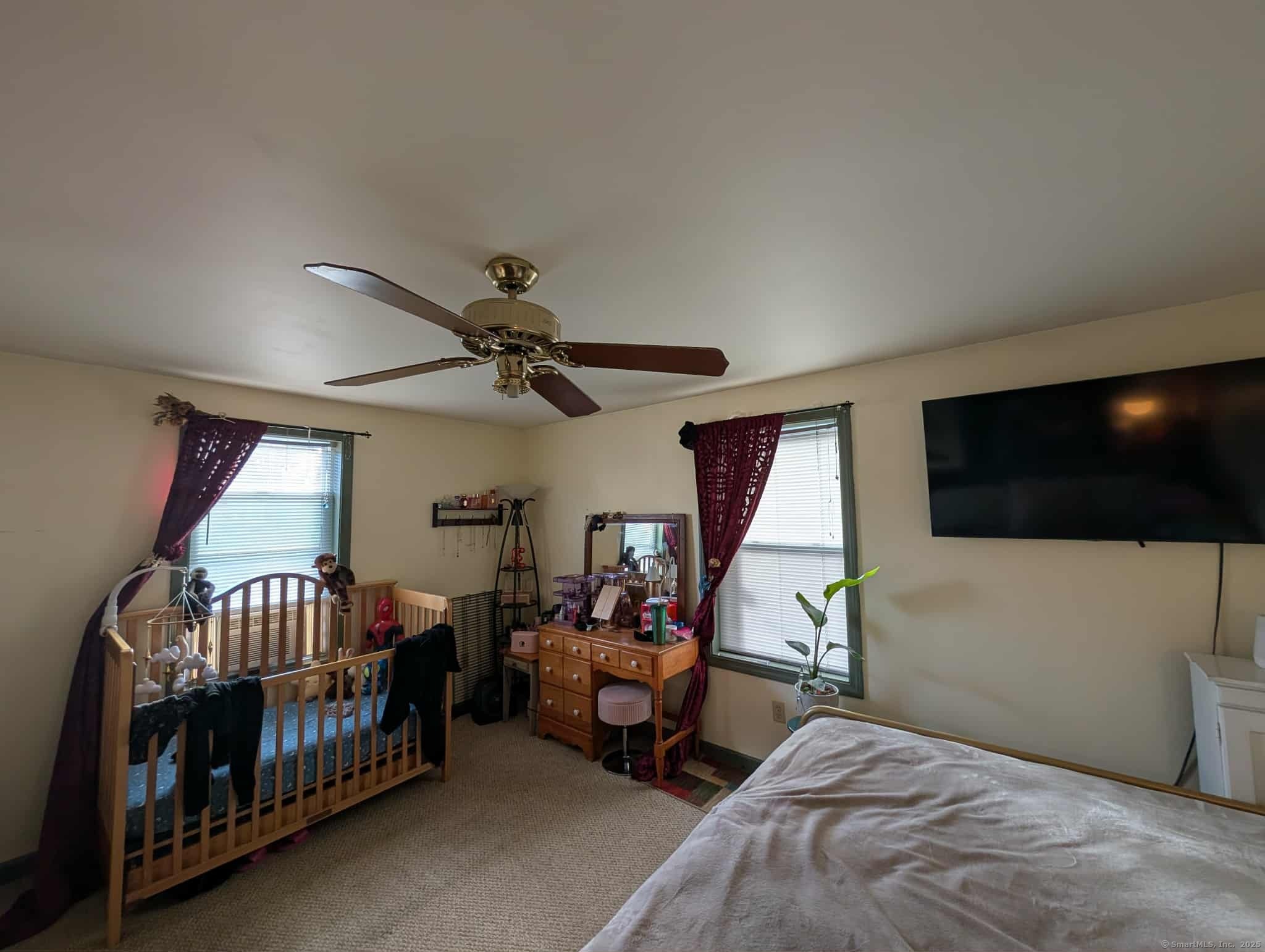 942 Riverside Drive Thompson, CT 06255 - Photo 12 of 21 a bedroom with furniture and a flat screen tv