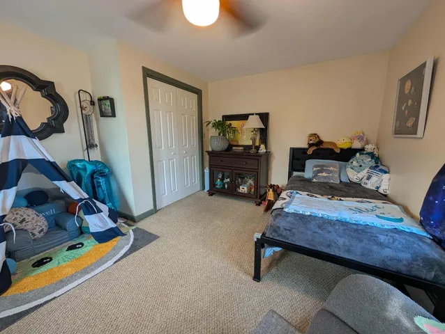 a bedroom with furniture and a window