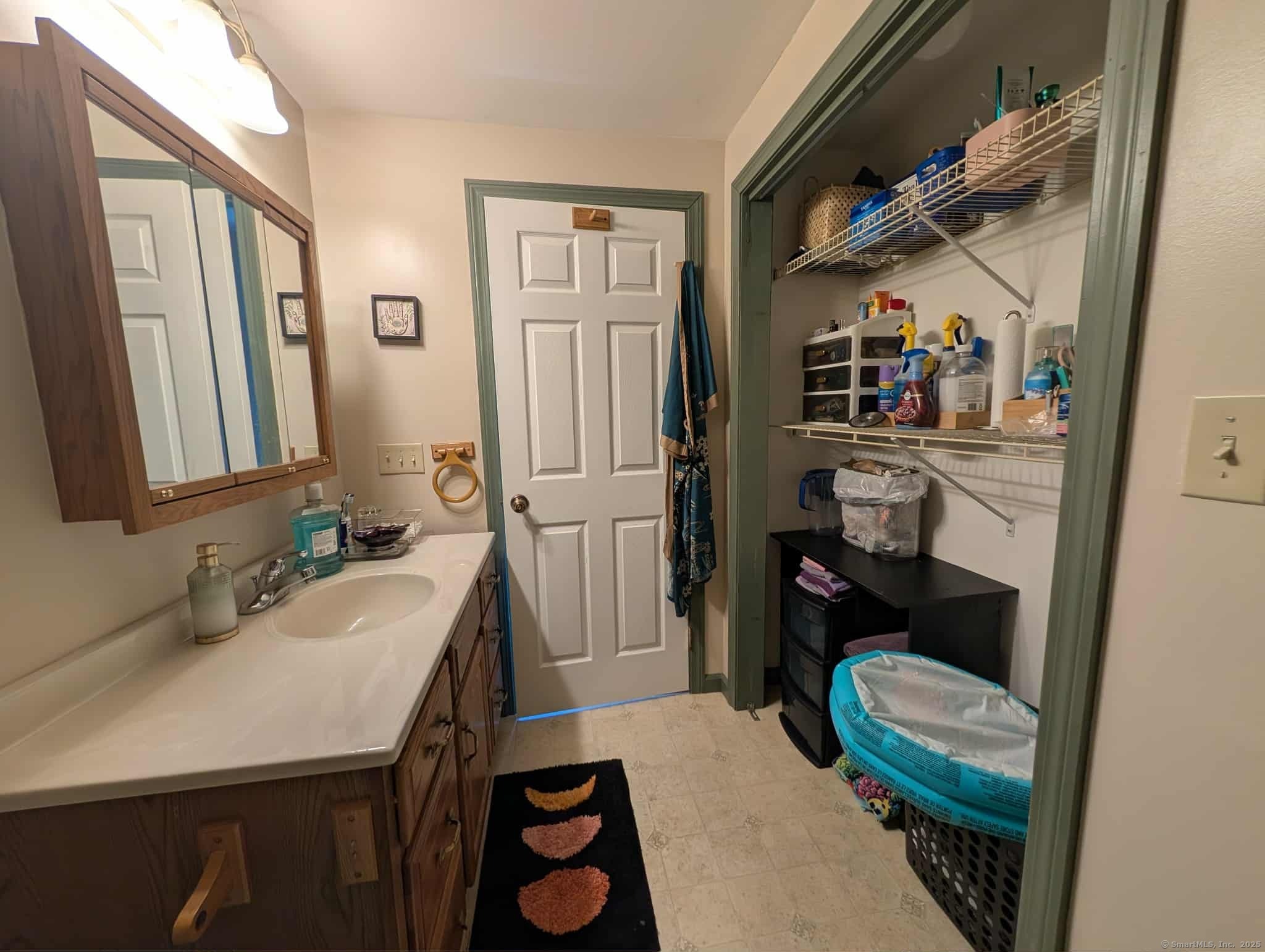 942 Riverside Drive Thompson, CT 06255 - Photo 17 of 21 a bathroom with a sink a toilet and shower curtain