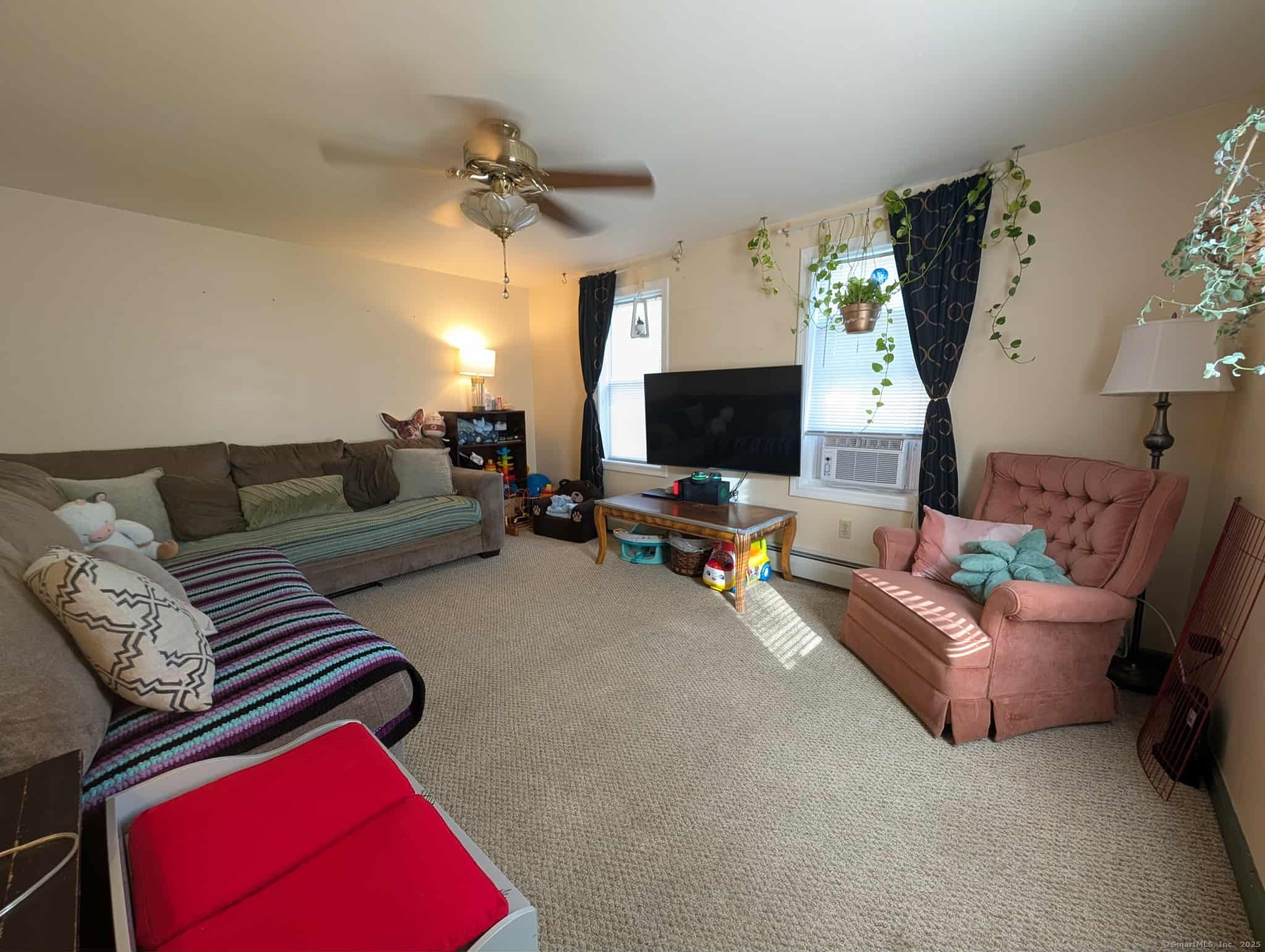 942 Riverside Drive Thompson, CT 06255 - Photo 8 of 21 a living room with furniture and a flat screen tv