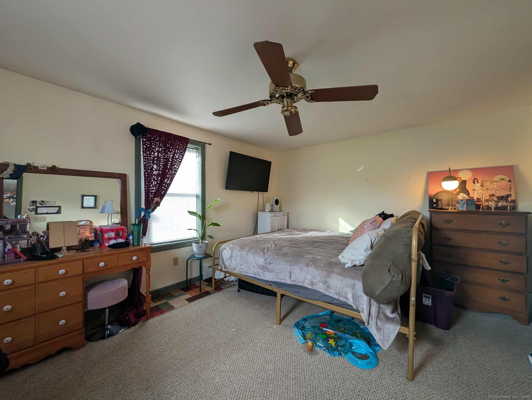 942 Riverside Drive Thompson, CT 06255 - Photo 10 of 21 a bed room with a bed and a dresser